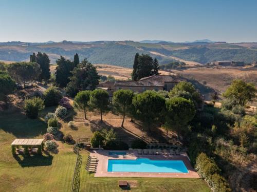 an aerial view of a house with a swimming pool at Apartment Pienza by Interhome in Vergelle