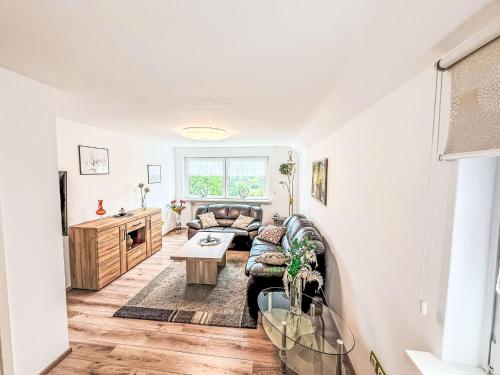 a living room with a couch and a table at Apartment Marie by Interhome in Schieder-Schwalenberg