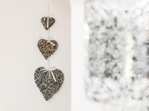 two hearts hanging on a wall next to a window at Apartment Varis Haven by Interhome in Forres