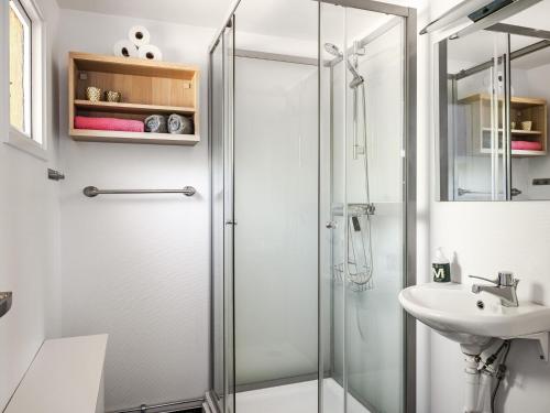 a bathroom with a shower and a sink at Holiday Home Stenlycke by Interhome in Ivö