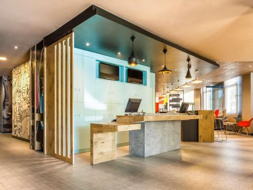 a kitchen with a counter and a counter top at Ibis Sevilla in Seville