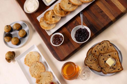 a table topped with plates of pastries and dips at Drury Inn & Suites Knoxville West in Knoxville