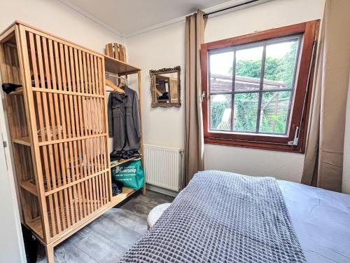 a bedroom with a bed and a window at Holiday Home Ferienhaus Inge & Henry an der Werra by Interhome in Altenburschla