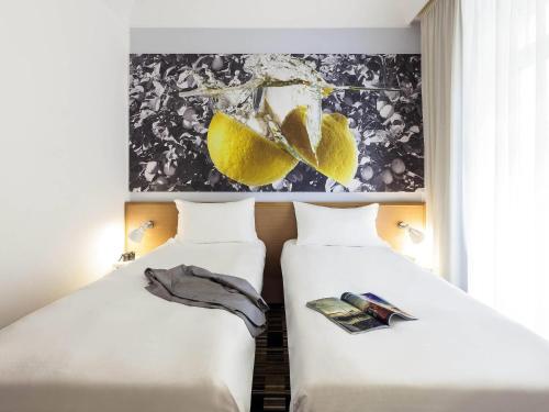 Ένα ή περισσότερα κρεβάτια σε δωμάτιο στο Ibis Styles Napoli Garibaldi