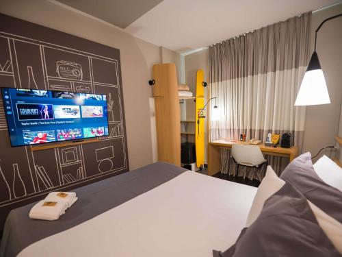 Ένα ή περισσότερα κρεβάτια σε δωμάτιο στο ibis Ribeirao Preto Shopping