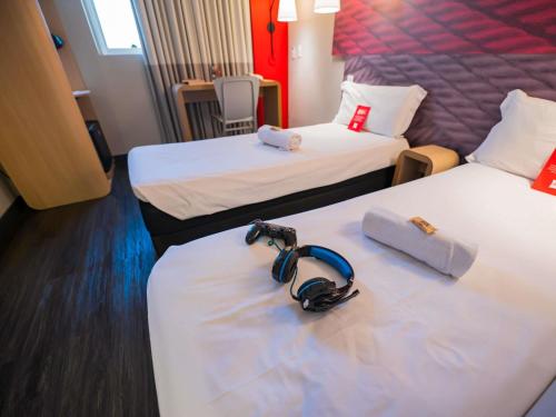 Ένα ή περισσότερα κρεβάτια σε δωμάτιο στο ibis Ribeirao Preto Shopping