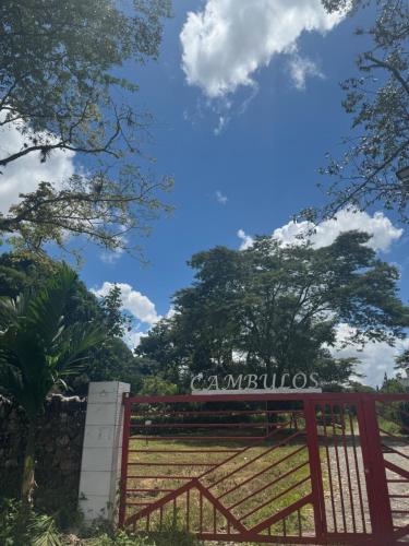 a sign for a gate at a park at Emi House in Acacías