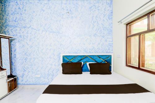 Postel nebo postele na pokoji v ubytování Hotel Ranjana Diamond