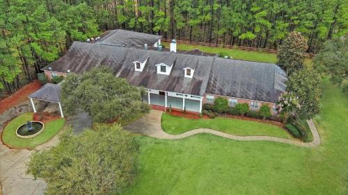 an aerial view of a large house with a yard at Tranquil 1 BR Studio in Grand Bay - Oak & Fountain in Grand Bay