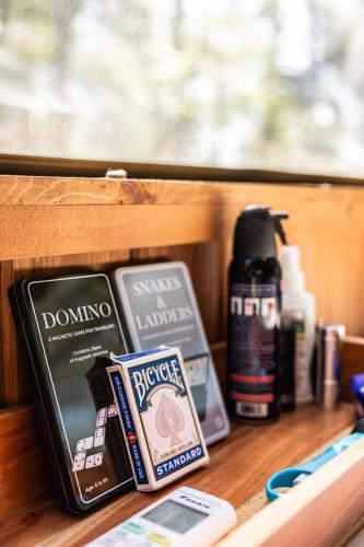 a wooden shelf with various items on it at Sunken Escapes Glamping Unit #2 in New Minas