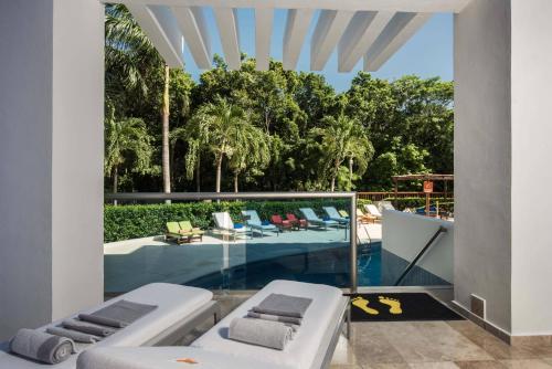 a view of a swimming pool from a house at Grand Sunset Princess - All Inclusive in Playa del Carmen