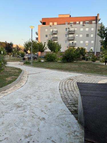 an empty street in front of a building at Apartman Mojsilović in Ub