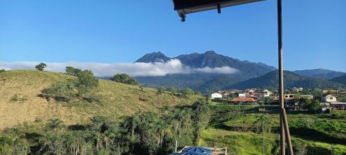 a view of a hill with a mountain in the background at ALTO DA COLINA LOCAÇÃO COM KITNETES e INFRA - Próximo do Centro de Penedo in Penedo