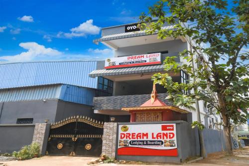 a dream land building with a dream lender sign on it at Hotel O Dream Land in Khandagiri