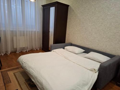 a bed with two pillows in a bedroom at Апартаменти ЖК Покровський двір Чабани in Chabany