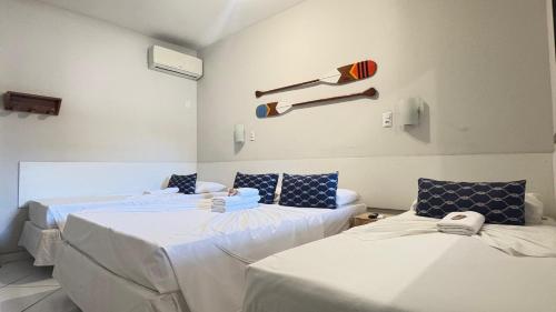 Una cama o camas en una habitación de Pousada Mar E Mata