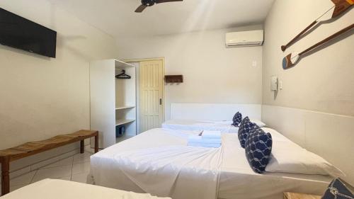 Una cama o camas en una habitación de Pousada Mar E Mata