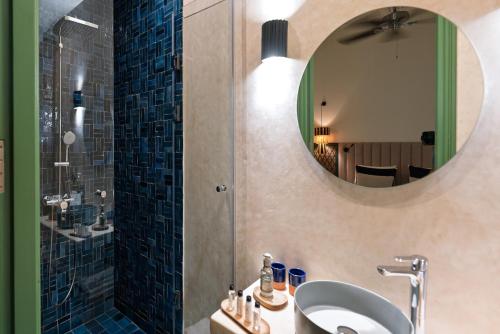 a bathroom with a sink and a mirror at Le Palazzo in Essaouira
