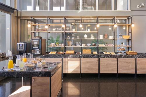a display case in a store with food on display at Almarena Madero Urbano Affiliated by Melia in Buenos Aires