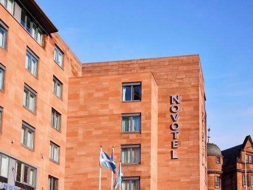 a building with a hotel sign on the side of it at Novotel Edinburgh Centre in Edinburgh