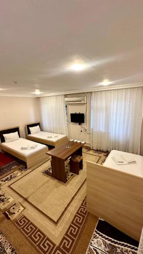 Postel nebo postele na pokoji v ubytování Masalli Hotel