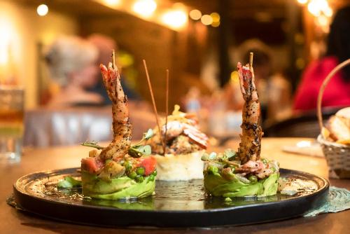three food items on a plate on a table at Quinta Don Jose Boutique Hotel in Guadalajara