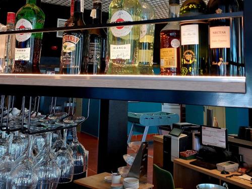a bunch of bottles of alcohol on a shelf at Ibis Jerez De La Frontera Cadiz in Jerez de la Frontera