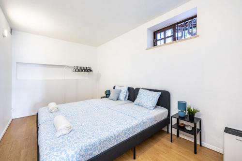 a bedroom with a bed and a window at Casa da Legua -Panoramic Ocean View w Terrace in Pataias