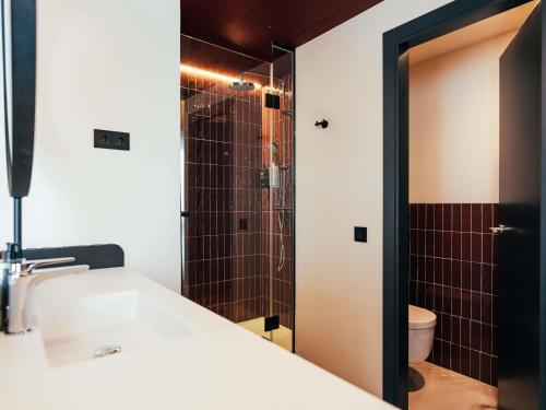 a bathroom with a sink and a shower at Ibis Styles Madrid Centro Maravillas in Madrid