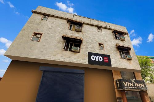 a building with aww sign on the side of it at HOTEL O VIN INN in New Delhi