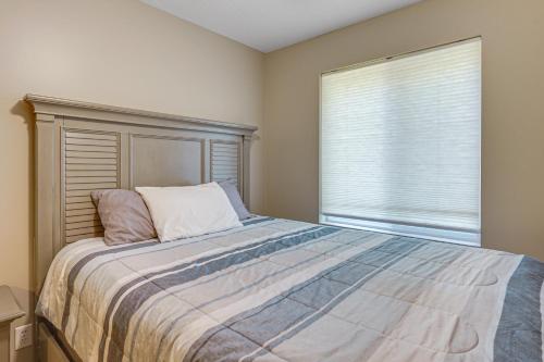 a bedroom with a large bed and a window at Hot Tub and Game Room Spacious Whitehall Home! in Whitehall