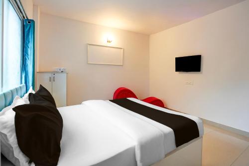 Ένα ή περισσότερα κρεβάτια σε δωμάτιο στο FabHotel Seven Elite