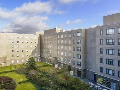 an overhead view of two large buildings with a yard at Novotel Suites Paris CDG Airport Villepinte in Roissy-en-France