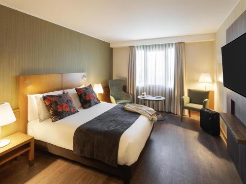 Katil atau katil-katil dalam bilik di Hotel Mercure Porto Gaia