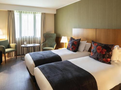 Katil atau katil-katil dalam bilik di Hotel Mercure Porto Gaia