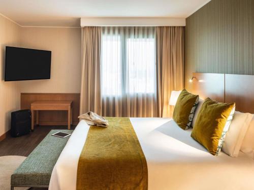 Katil atau katil-katil dalam bilik di Hotel Mercure Porto Gaia
