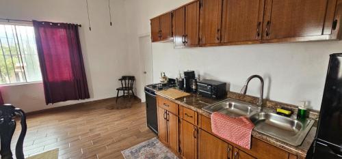 a kitchen with a sink and a counter top at Guest Studio near Businesses and Markets in Ensenada