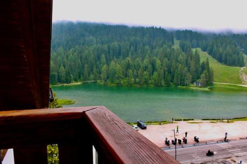 a view of a large lake from a balcony at Balcone sulle Tre Cime di Lavaredo in Misurina