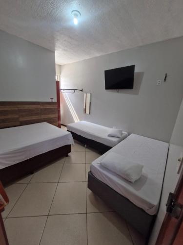 Ένα ή περισσότερα κρεβάτια σε δωμάτιο στο Hotel Akemi