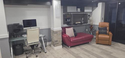 an office with two chairs and a desk with a computer at Staycation Oasis! a unique Experience! Heated pool open until October 31st in Easton