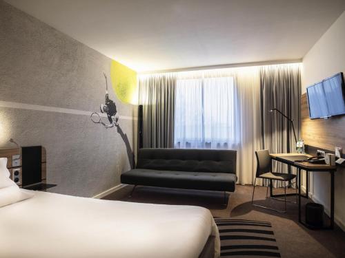 Katil atau katil-katil dalam bilik di Novotel Kraków Centrum
