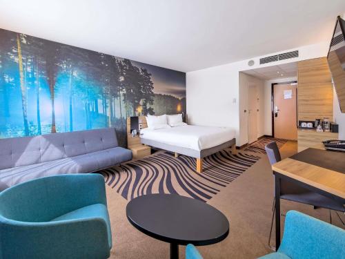 Katil atau katil-katil dalam bilik di Novotel Kraków Centrum