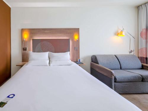 Katil atau katil-katil dalam bilik di Novotel Kraków Centrum