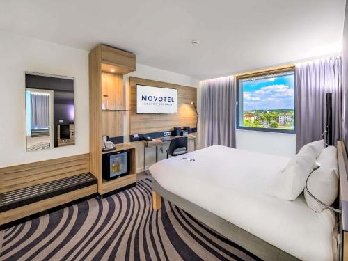 Katil atau katil-katil dalam bilik di Novotel Kraków Centrum