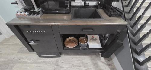 a counter with two donuts inside of it at Staycation Oasis! a unique Experience! Heated pool open until October 31st in Easton
