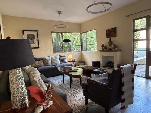 a living room with a couch and a table at Casa Arroyo in San Miguel de Allende