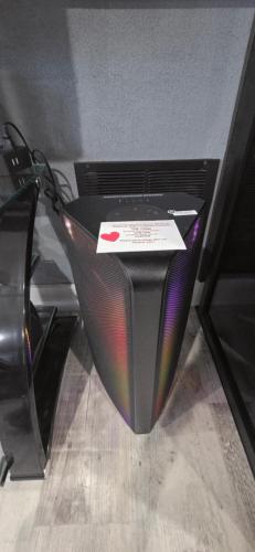 a black computer monitor sitting on a wooden floor at Staycation Oasis! a unique Experience! Heated pool open until October 31st in Easton