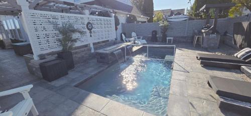 an overhead view of a swimming pool in a backyard at Staycation Oasis! a unique Experience! Heated pool open until October 31st in Easton