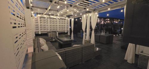 a room with a couch and a table and chairs at Staycation Oasis! a unique Experience! Heated pool open until October 31st in Easton