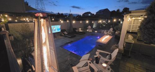 an overhead view of a swimming pool at night at Staycation Oasis! a unique Experience! Heated pool open until October 31st in Easton